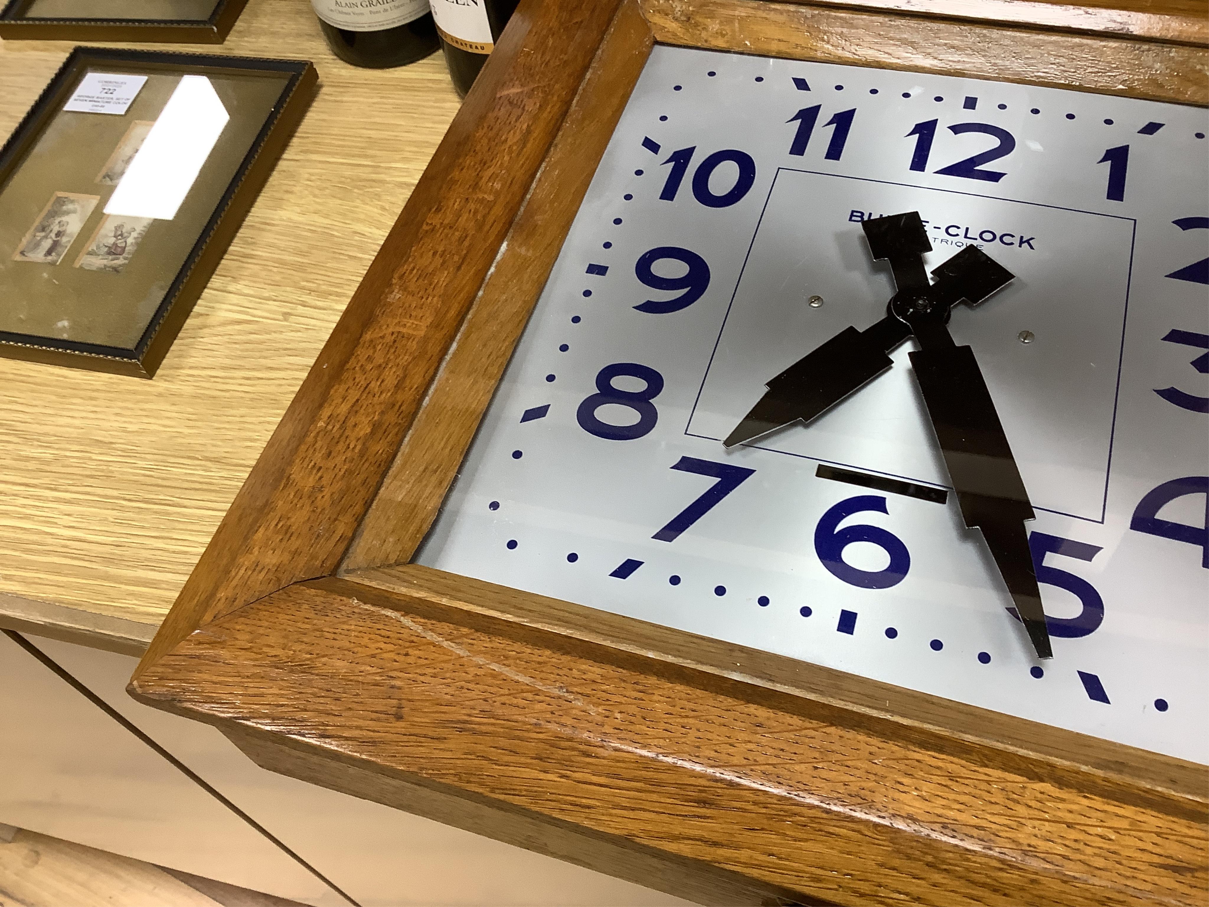 An early 20th century French Art Deco Bulle Electrique oak wall clock, 39cm squared. Condition - scratch to oak on front cover, not checked if working